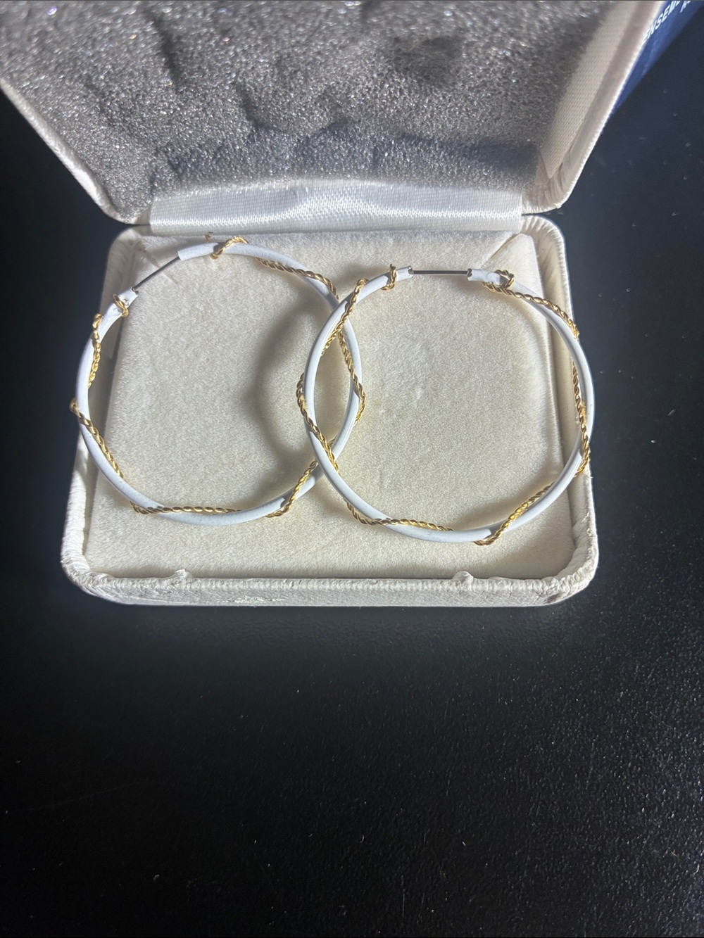 White earrings with gold wrapped around